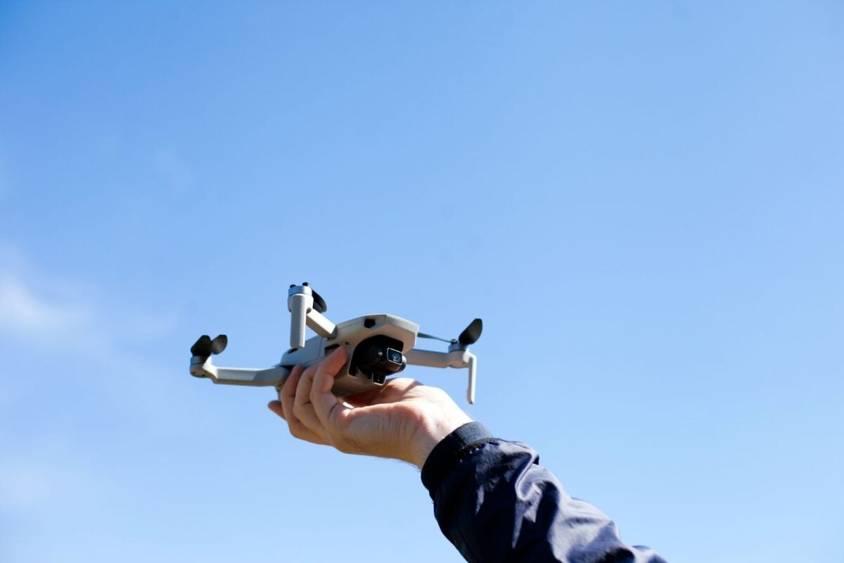 Man operating a drone